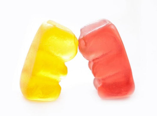 Two gummies kissing